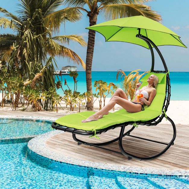 silla de playa con dosel y sombrilla