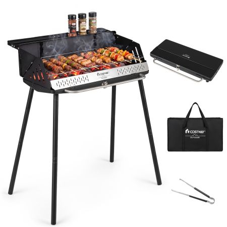 Barbacoa de carbón portátil con bandeja lateral para condimentos, ideal para asar en jardín, picnic o camping.